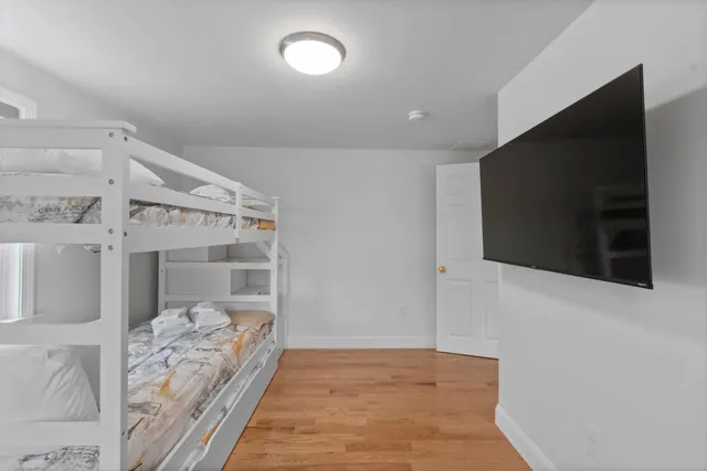 a bathroom with a sink mirror vanity and toilet