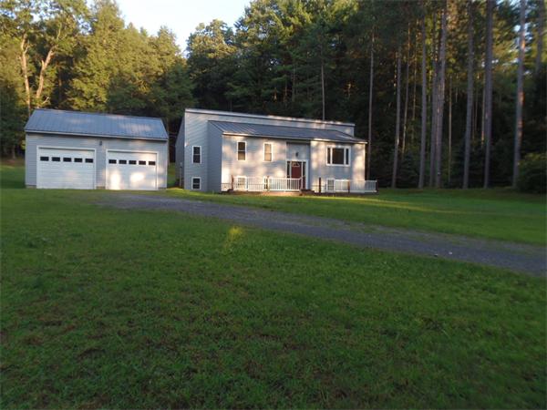 42 Montague Road Sunderland, MA 01375 - Photo 19 of 21 a view of a big house with a big yard and large trees