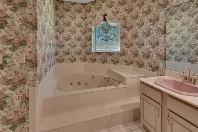 a bathroom with a bathtub and sink