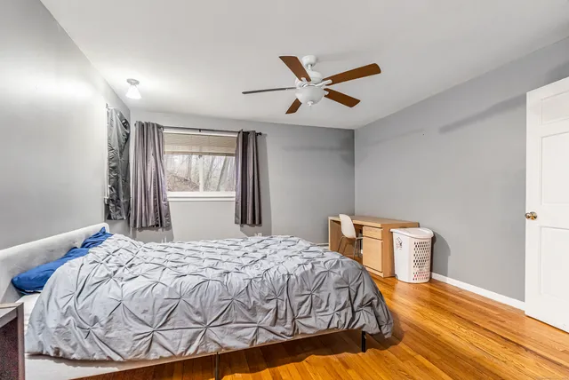 a bedroom with a bed and window