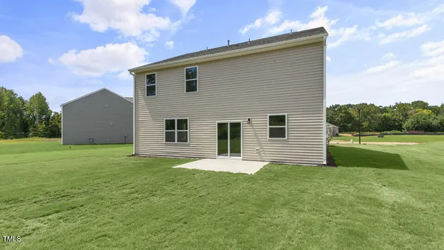 a backyard of a house with lots of green space