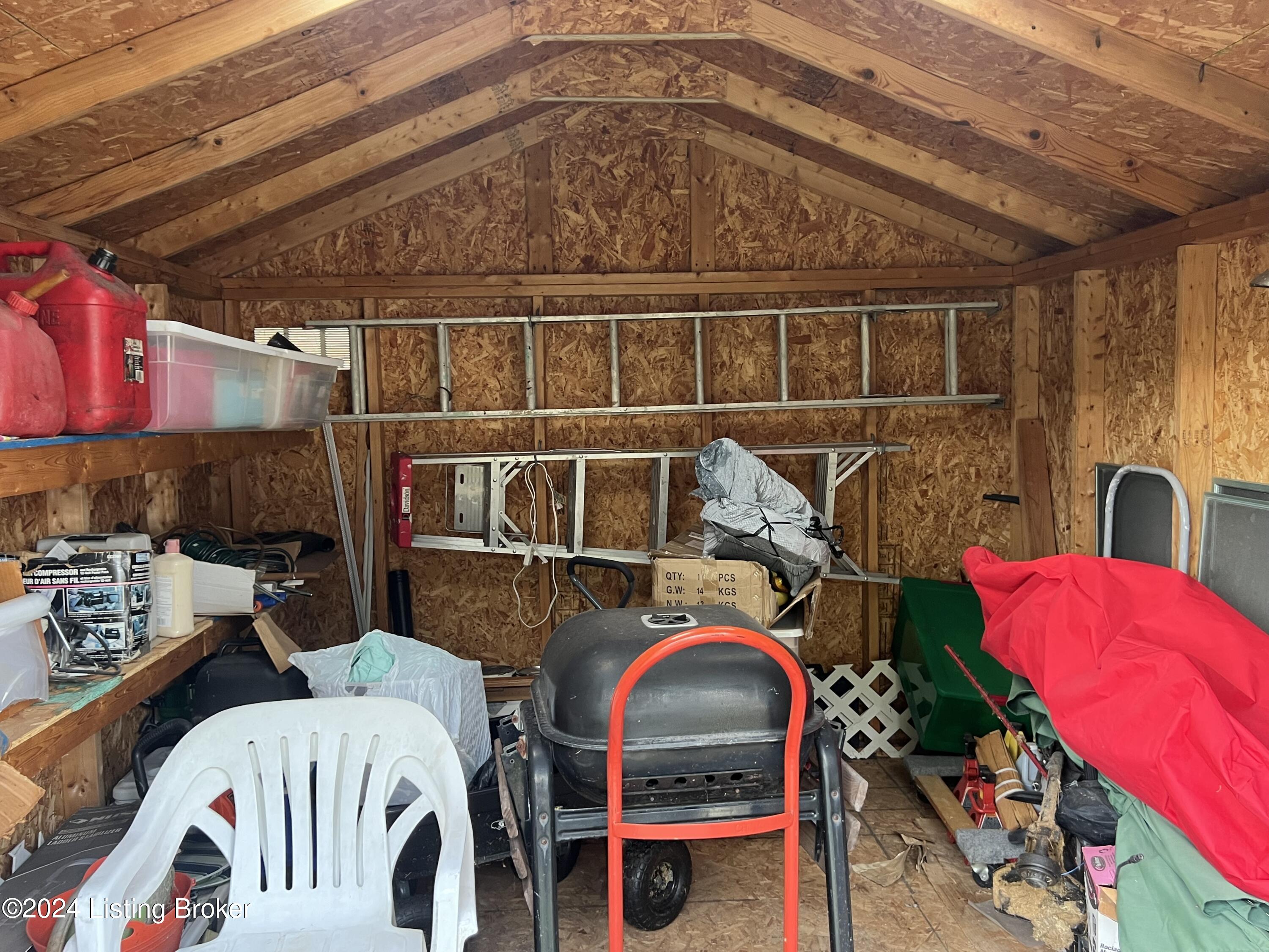 5403 Maryman Road Louisville, KY 40258 - Photo 35 of 36 interior of shed provides great storage with shelving and hanging hardware