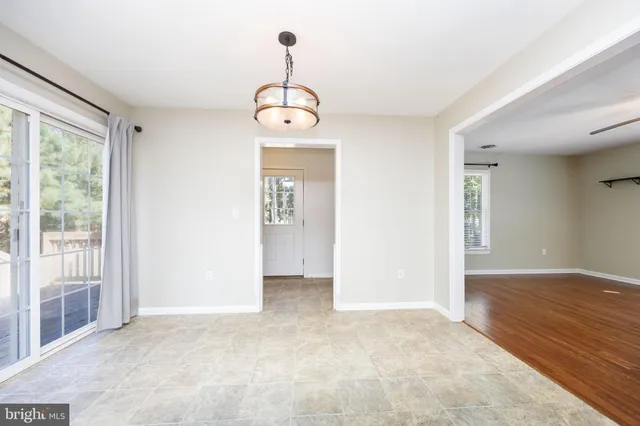 a kitchen with stainless steel appliances granite countertop wooden cabinets a stove a sink and dishwasher