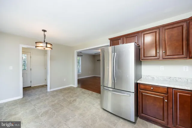 a bathroom with a sink vanity and a mirror
