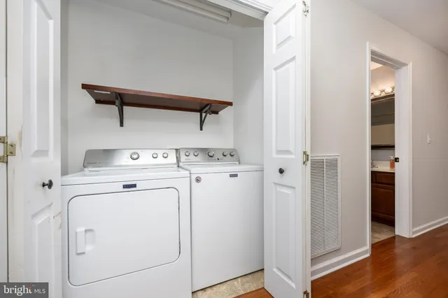 a view of a balcony with wooden floor and fence
