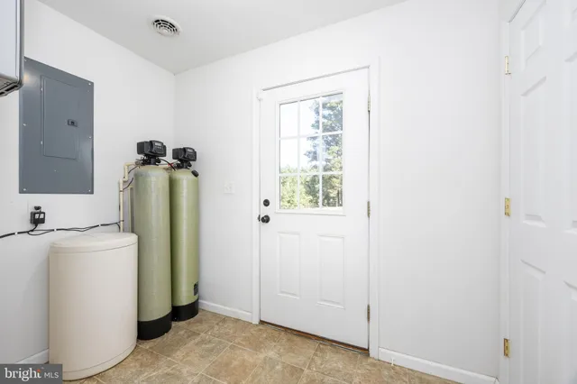 a view of balcony with wooden floor and fence