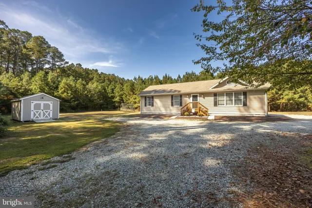 a view of a house with a yard and garage