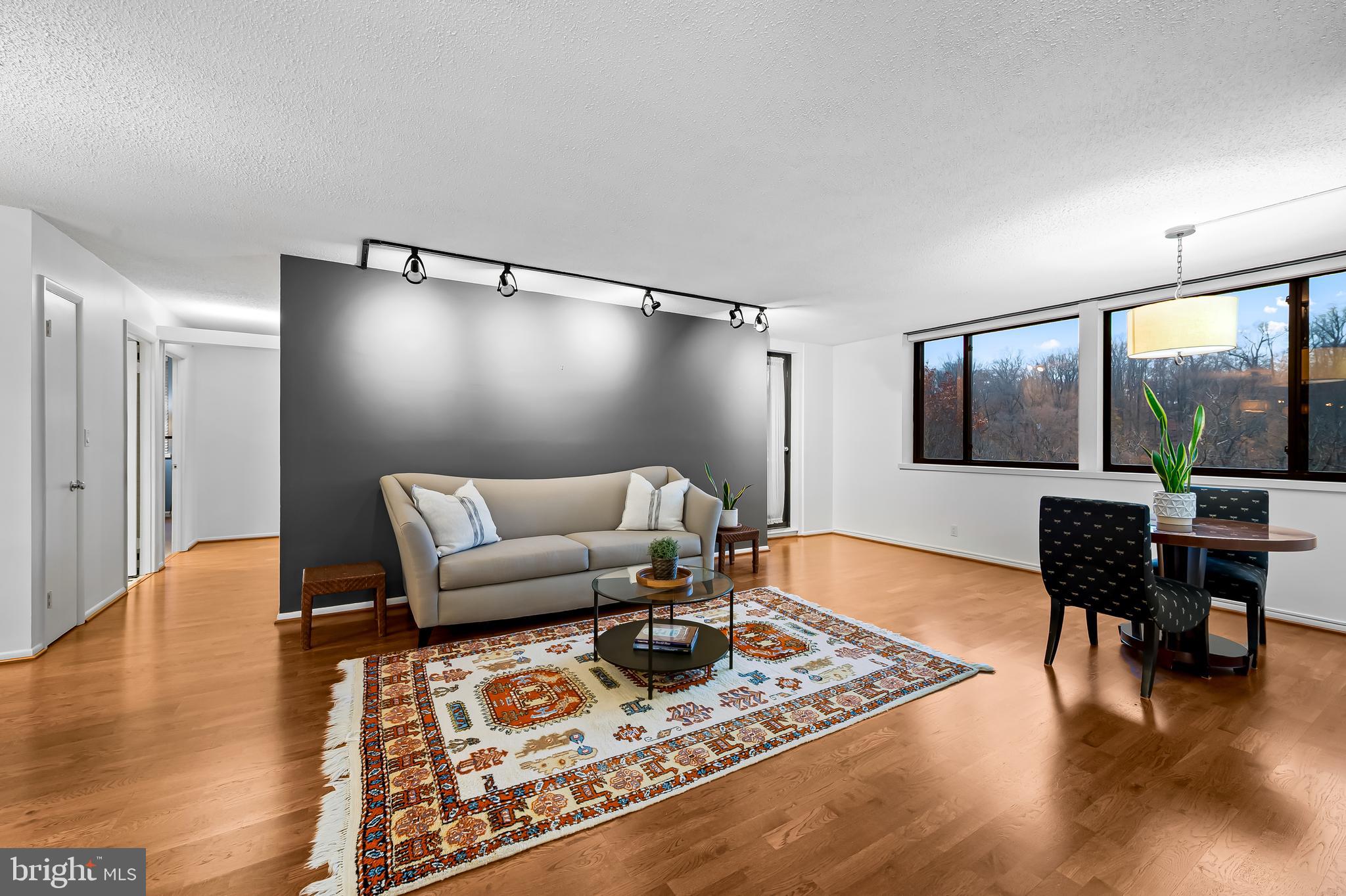 111 Hamlet Hill Road, Unit 1113 Baltimore, MD 21210 - Photo 3 of 27 a living room with furniture and a flat screen tv