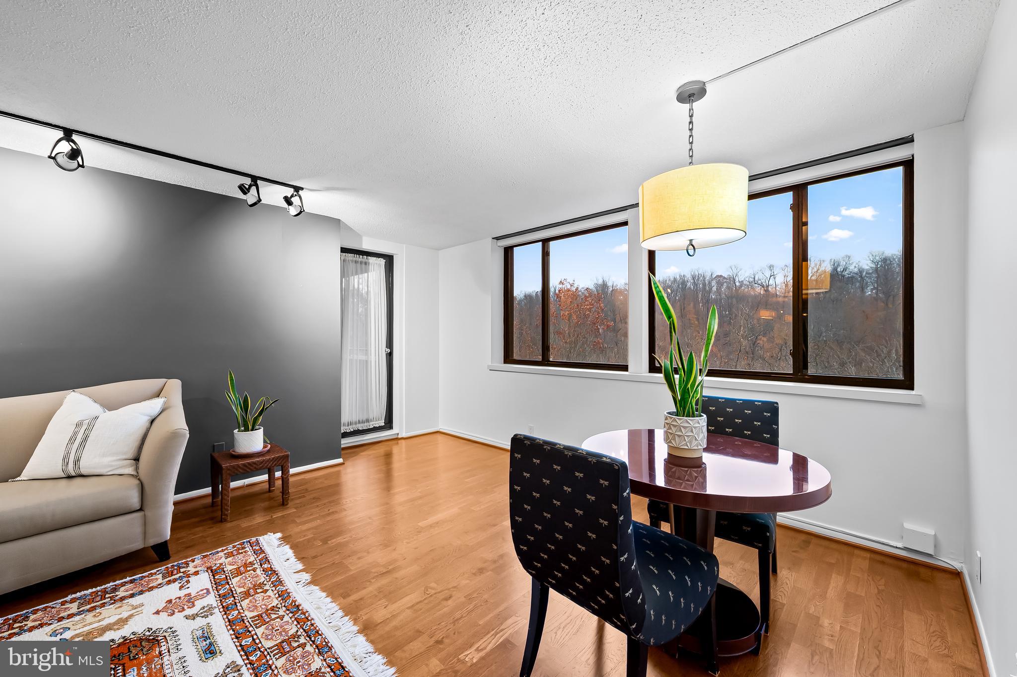 111 Hamlet Hill Road, Unit 1113 Baltimore, MD 21210 - Photo 5 of 27 a living room with furniture and a wooden floor