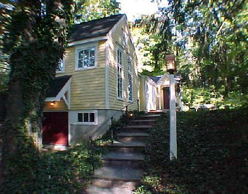 a front view of a house with garden