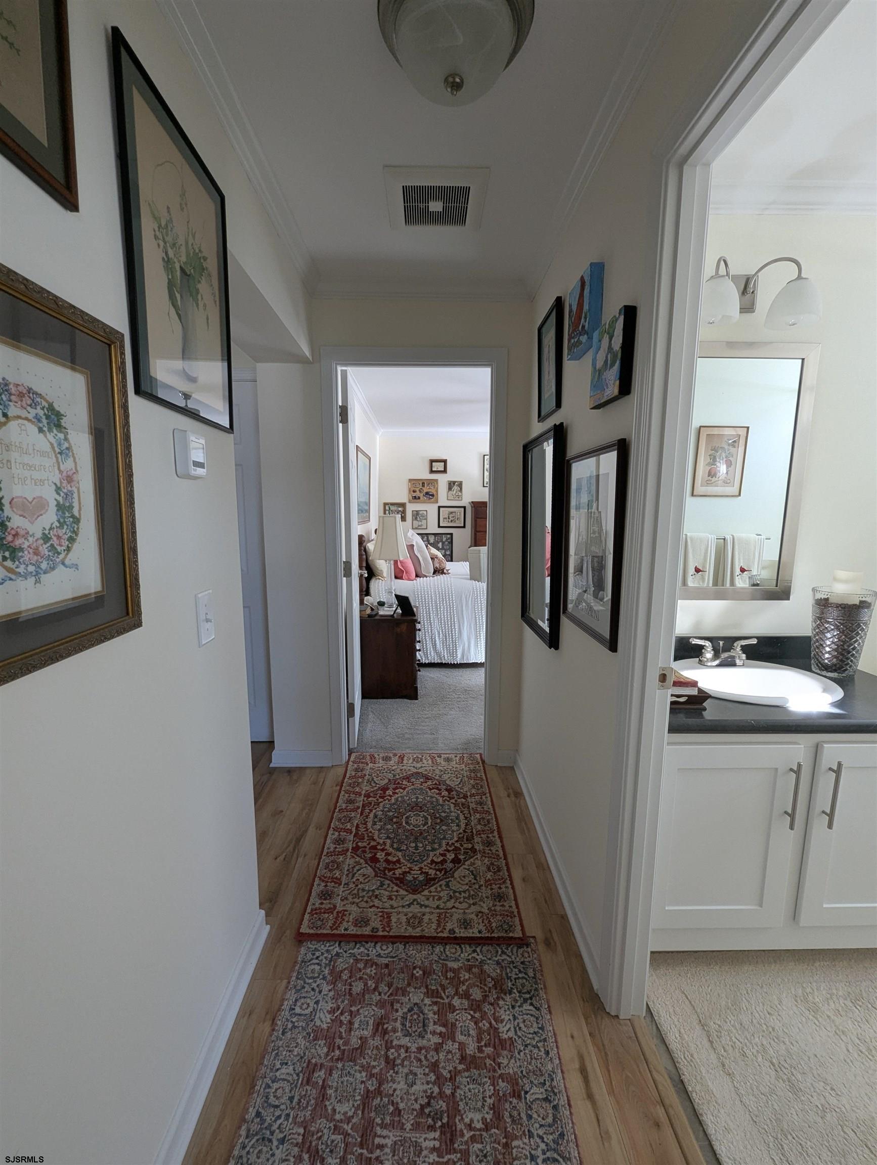 2058 Shore Road Seaville, NJ 08230 - Photo 15 of 29 a bathroom with a sink and mirror