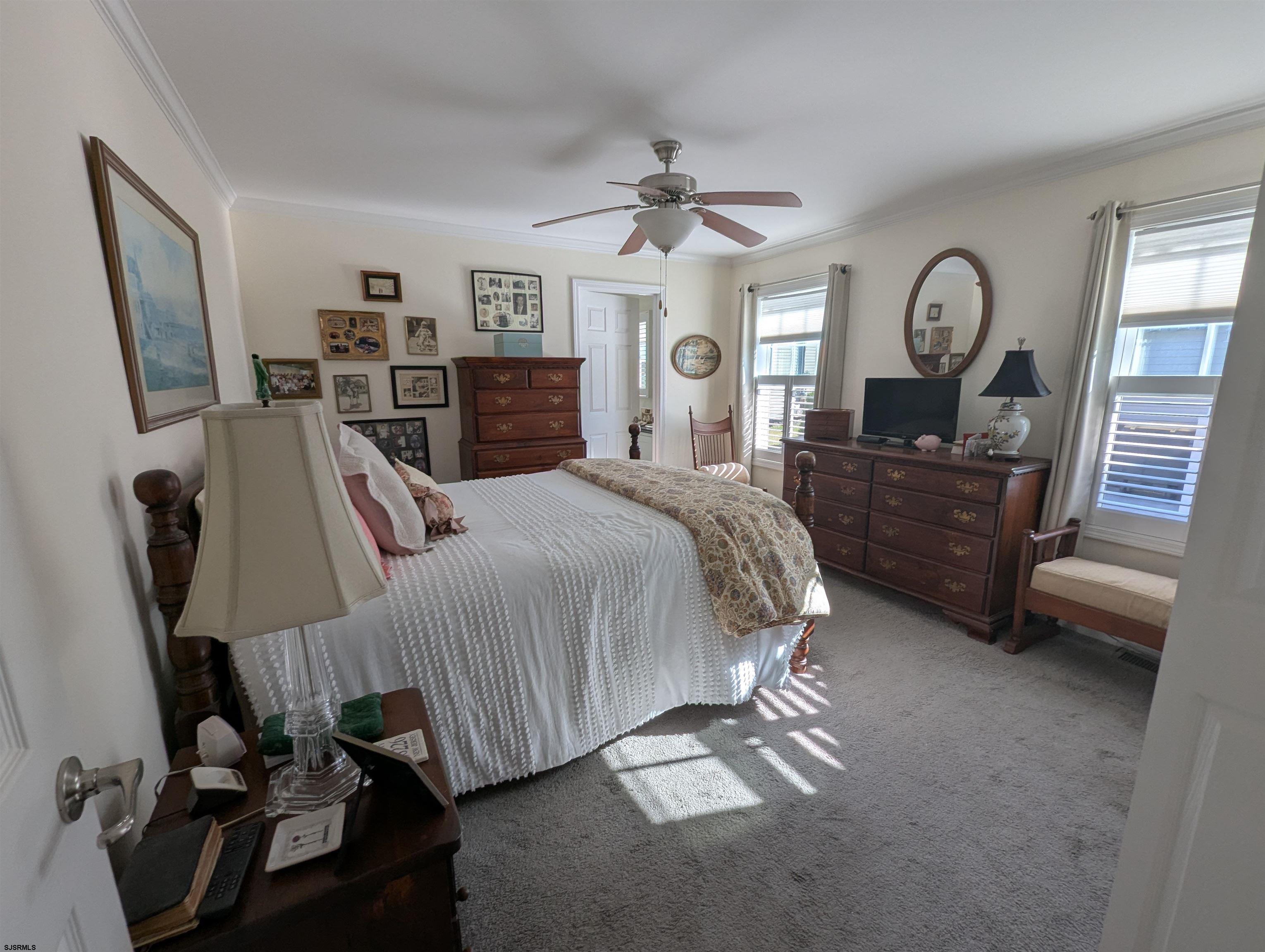 2058 Shore Road Seaville, NJ 08230 - Photo 17 of 29 a bed room with a bed window and dresser