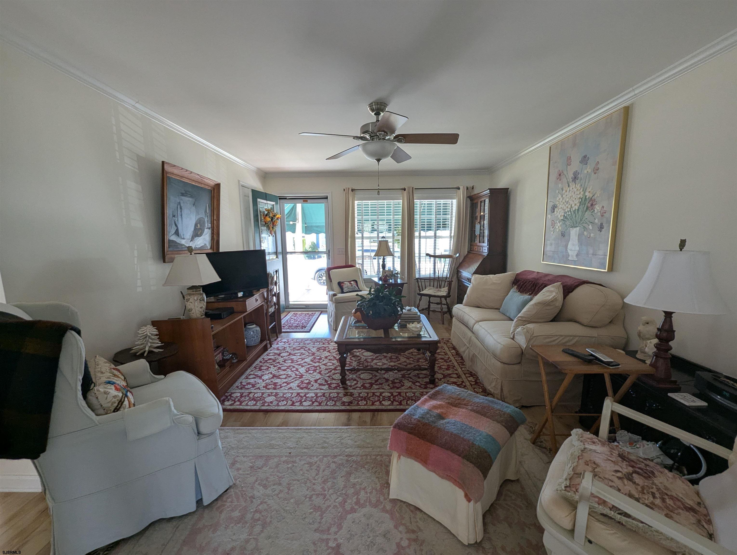 2058 Shore Road Seaville, NJ 08230 - Photo 2 of 29 a living room with furniture ceiling fan and a window