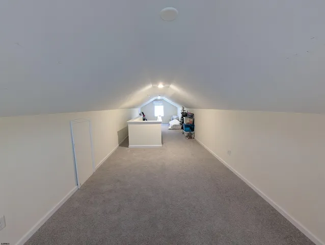 a view of empty room with a fireplace