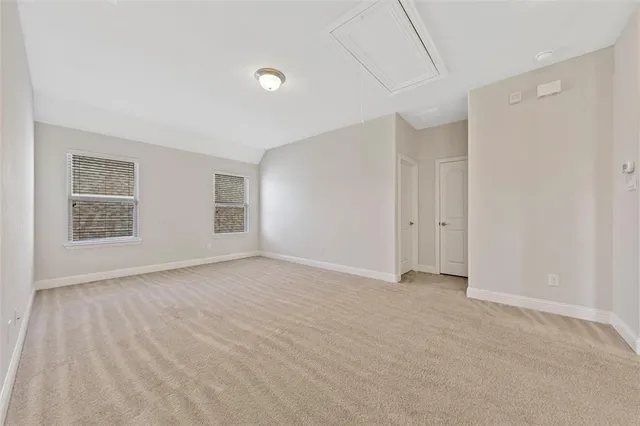 a view of empty room with windows