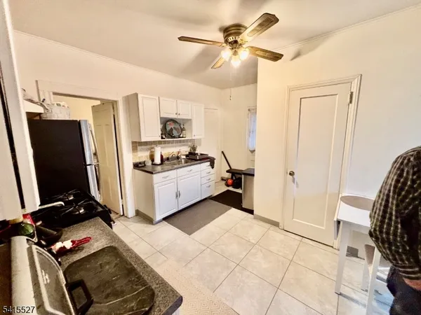 a view of living room with furniture and a flat screen tv