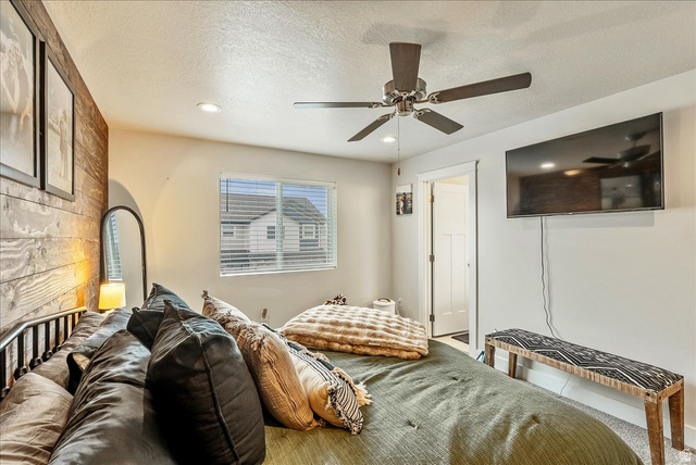 287 North 100th West Morgan, UT 84050 - Photo 16 of 27 Bedroom featuring recessed lighting, a textured ceiling, and a ceiling fan
