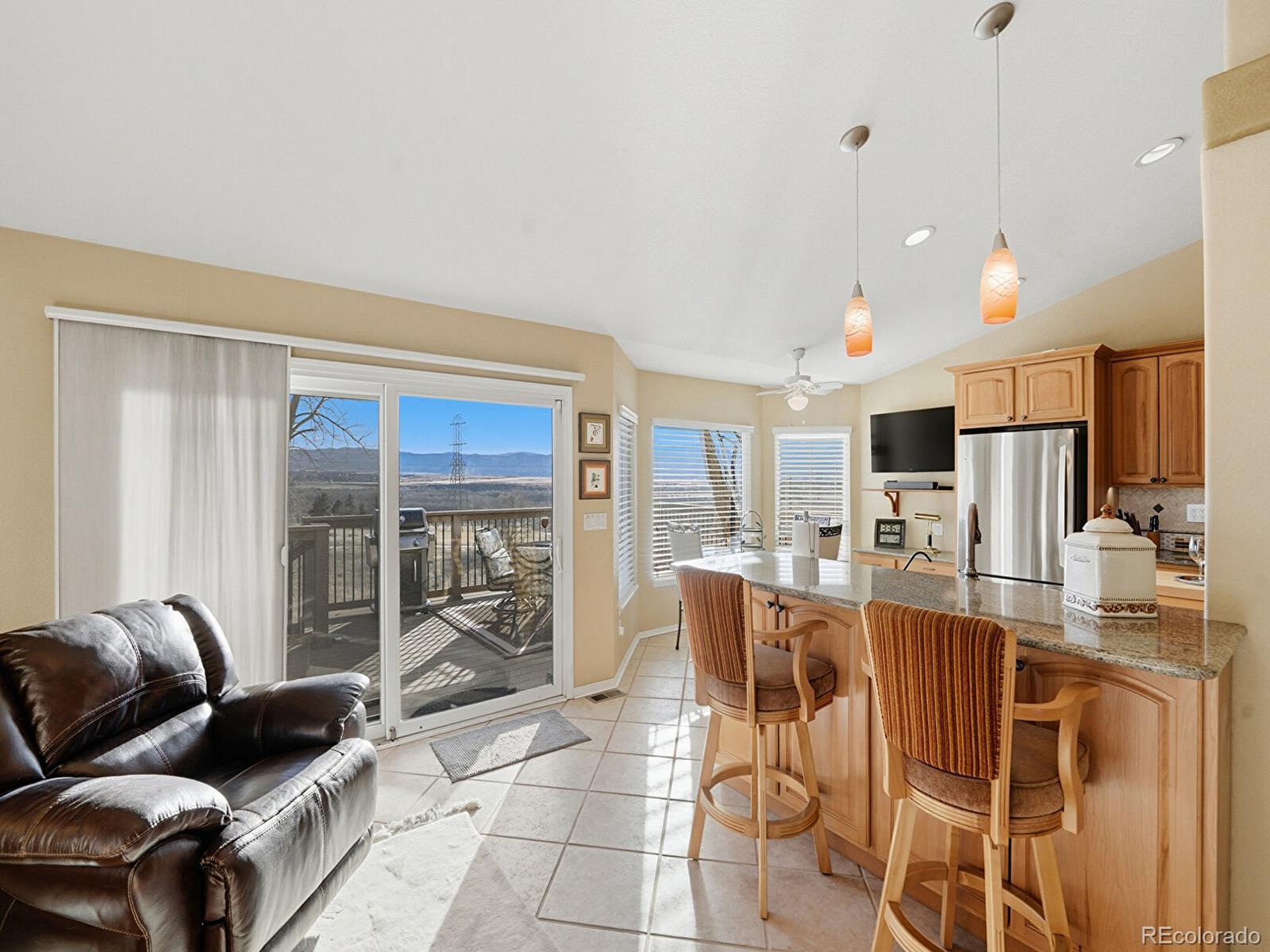 3308 Oak Leaf Place Highlands Ranch, CO 80129 - Photo 11 of 50 a living room with lots of furniture and a large window