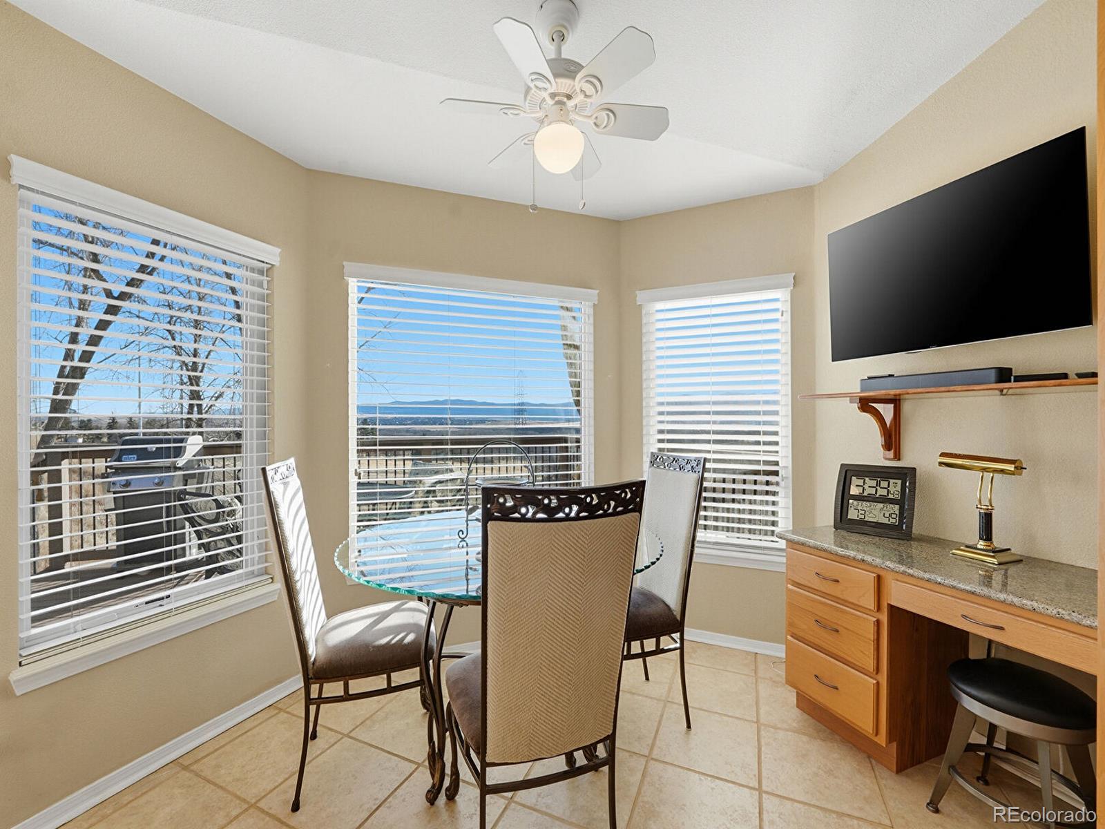 3308 Oak Leaf Place Highlands Ranch, CO 80129 - Photo 12 of 50 a dining room with furniture and window