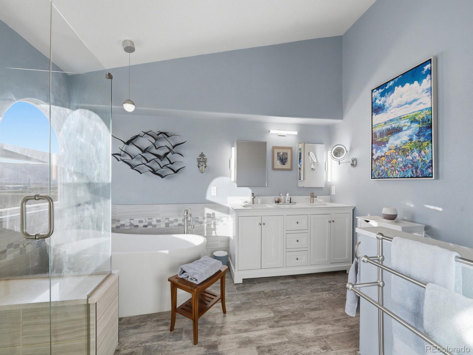 3308 Oak Leaf Place Highlands Ranch, CO 80129 - Photo 18 of 50 a spacious bathroom with a granite countertop sink a toilet a mirror and vanity