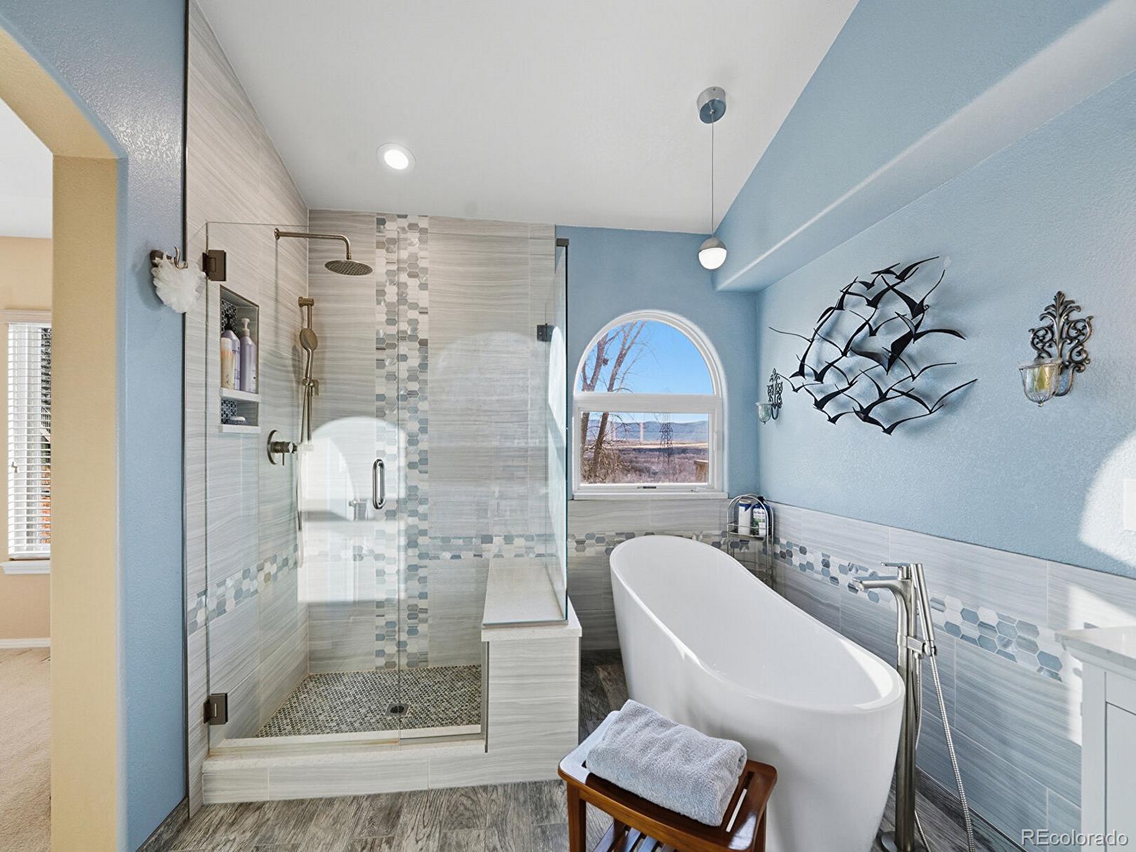 3308 Oak Leaf Place Highlands Ranch, CO 80129 - Photo 19 of 50 a bathroom with a mirror a sink and a mirror