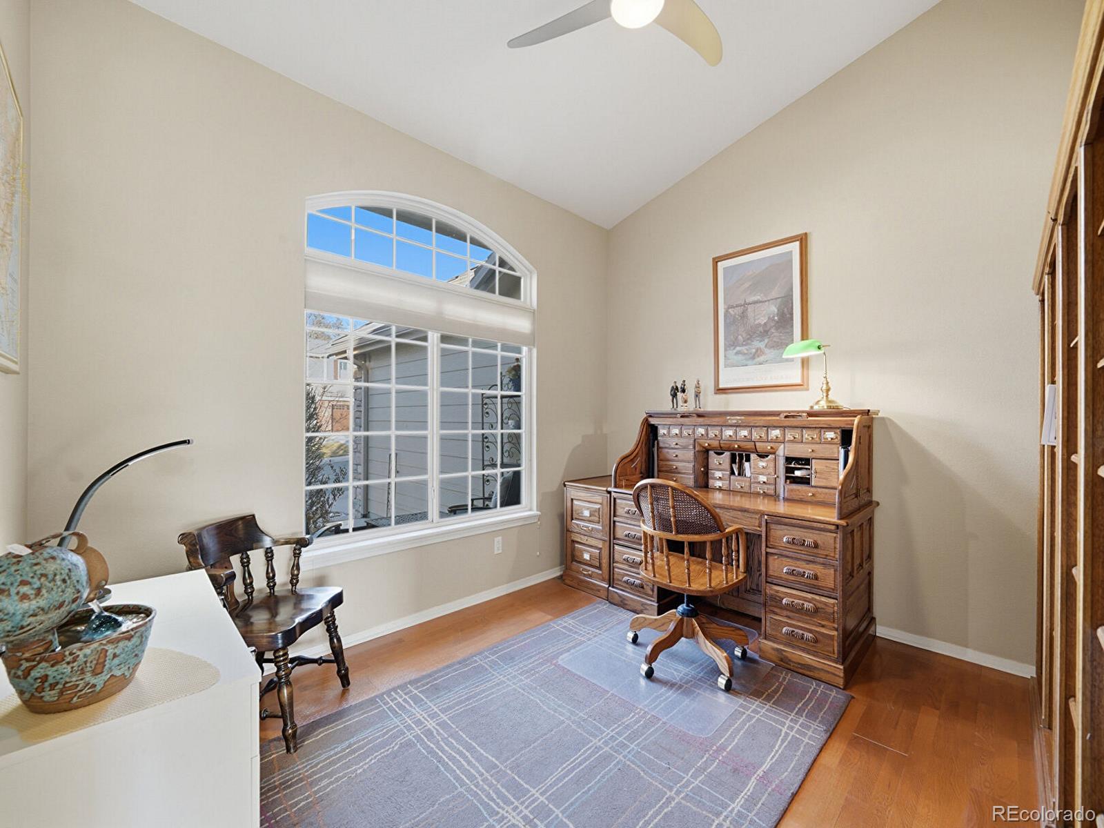 3308 Oak Leaf Place Highlands Ranch, CO 80129 - Photo 22 of 50 a view of a workspace with furniture and a window