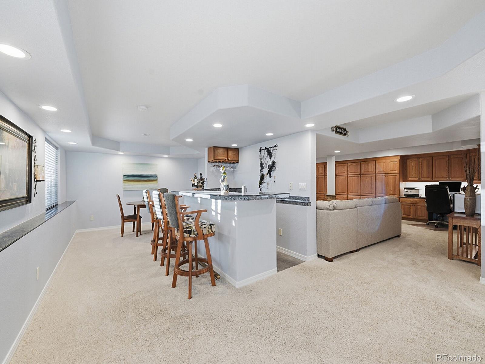 3308 Oak Leaf Place Highlands Ranch, CO 80129 - Photo 24 of 50 a kitchen with a table and chairs