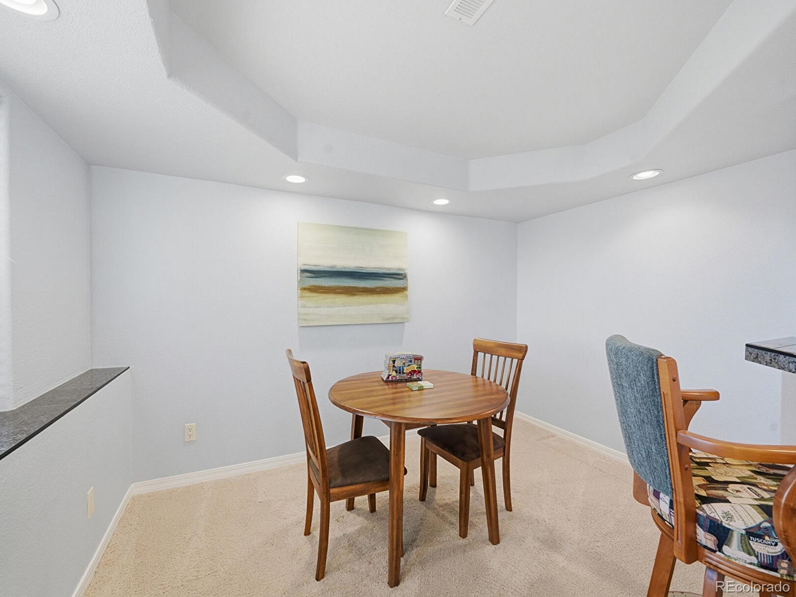 3308 Oak Leaf Place Highlands Ranch, CO 80129 - Photo 29 of 50 a dining room with furniture and wooden floor