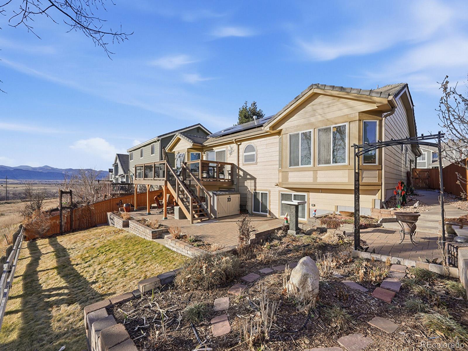 3308 Oak Leaf Place Highlands Ranch, CO 80129 - Photo 33 of 50 a view of a house with a yard