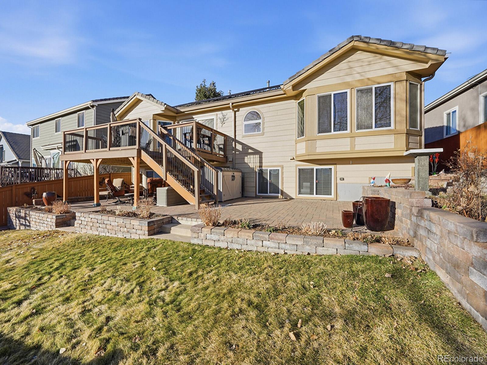 3308 Oak Leaf Place Highlands Ranch, CO 80129 - Photo 34 of 50 a front view of a house with garden
