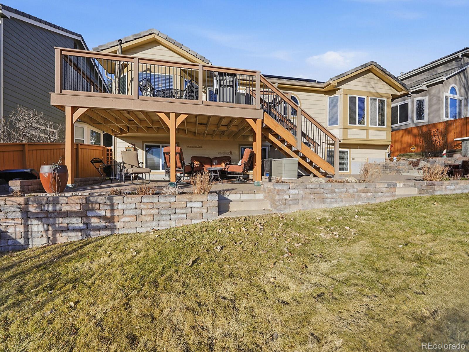 3308 Oak Leaf Place Highlands Ranch, CO 80129 - Photo 36 of 50 a view of a building with many windows