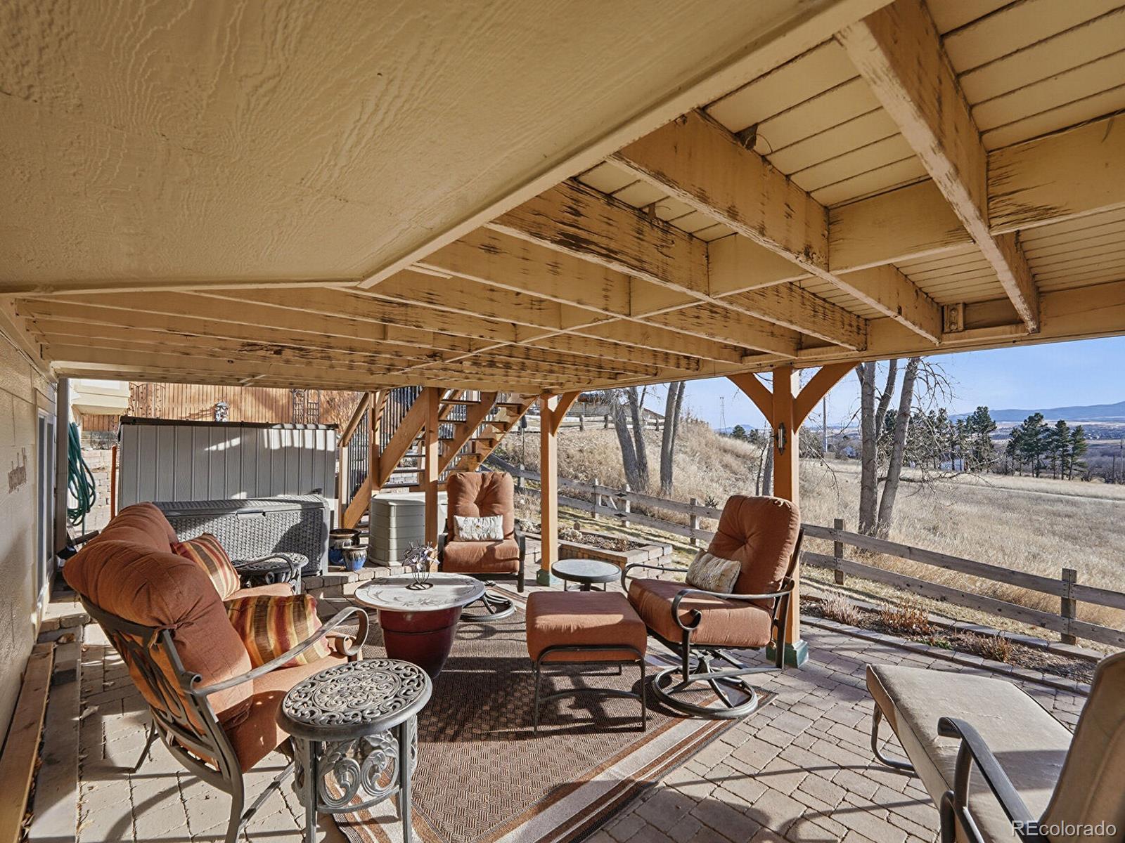 3308 Oak Leaf Place Highlands Ranch, CO 80129 - Photo 39 of 50 a view of chair and tables in the patio