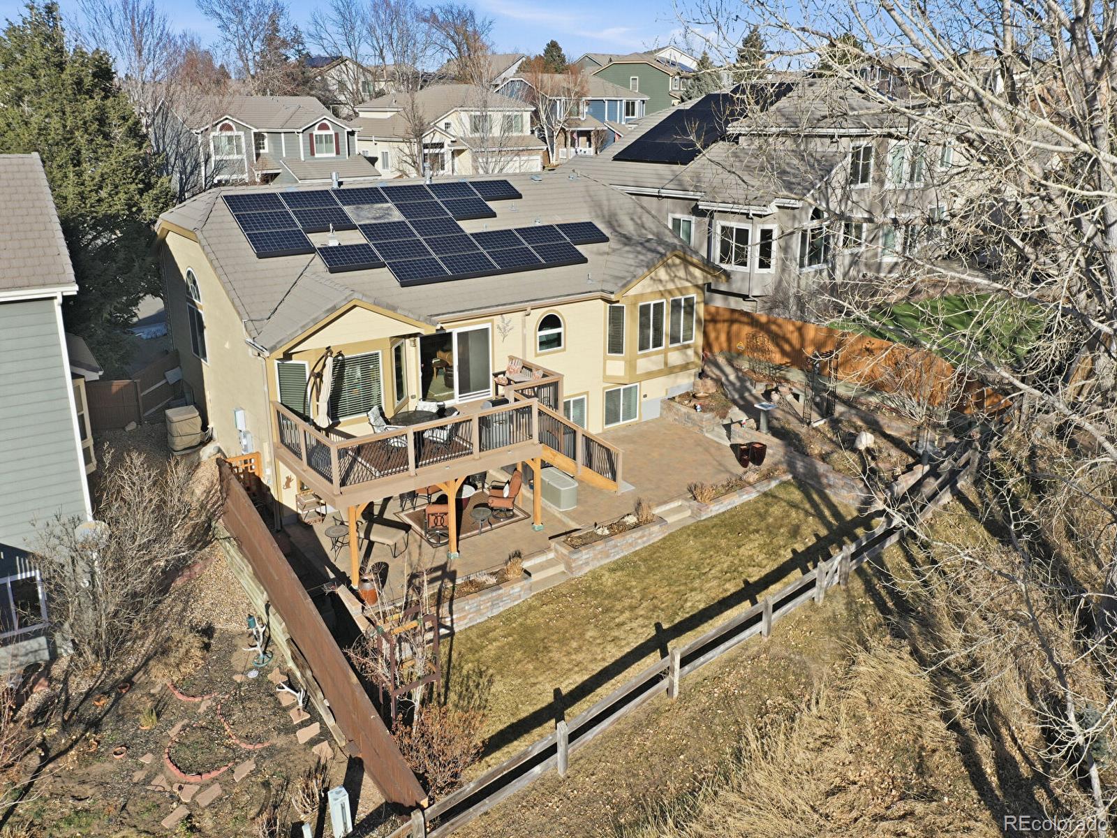 3308 Oak Leaf Place Highlands Ranch, CO 80129 - Photo 4 of 50 an aerial view of a house with large trees