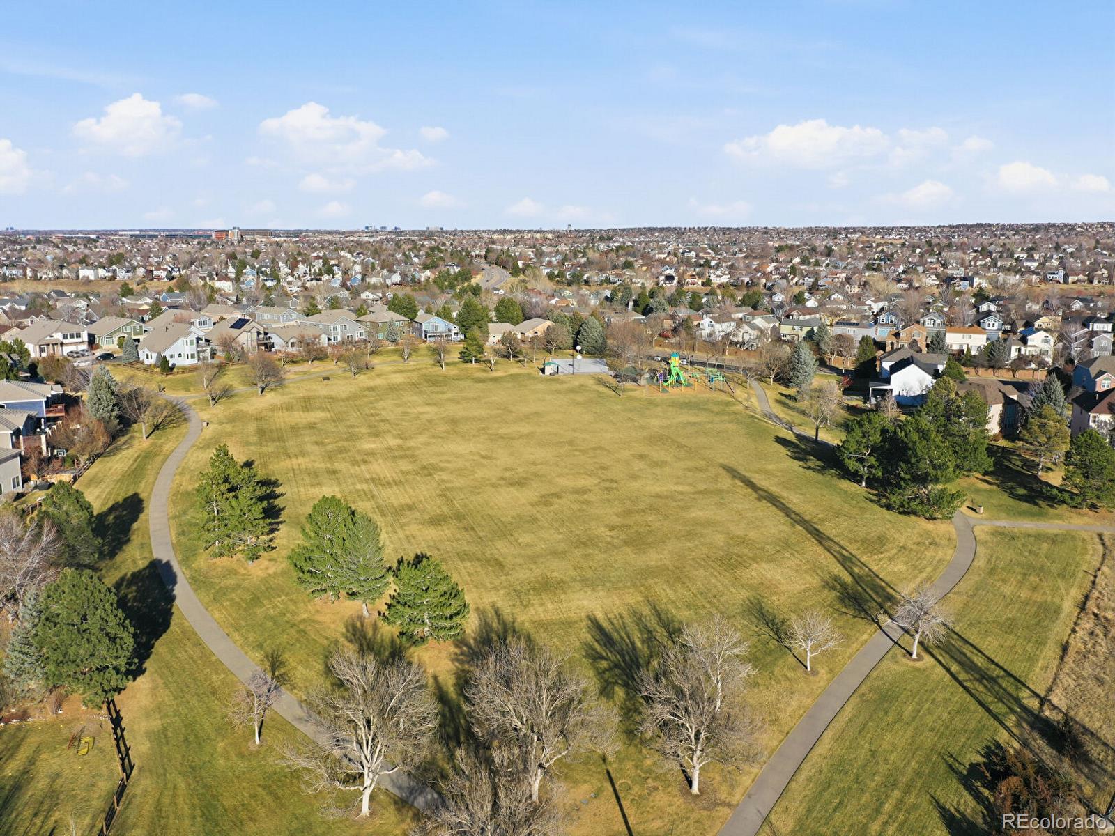 3308 Oak Leaf Place Highlands Ranch, CO 80129 - Photo 43 of 50 an aerial view of residential houses with city view
