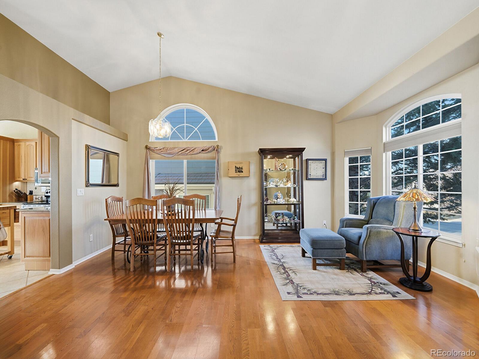3308 Oak Leaf Place Highlands Ranch, CO 80129 - Photo 7 of 50 a view of a dining room with furniture window and wooden floor