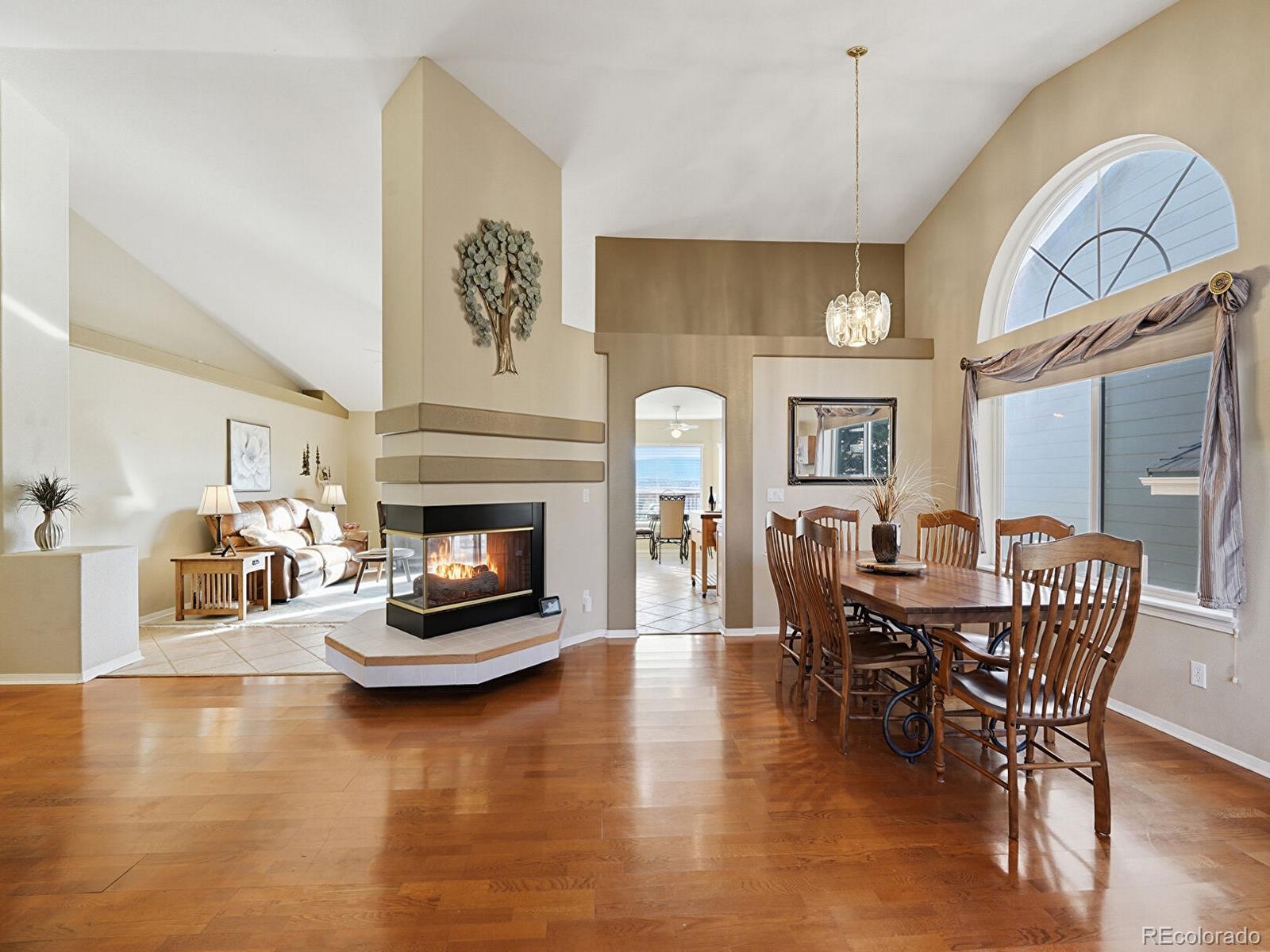 3308 Oak Leaf Place Highlands Ranch, CO 80129 - Photo 8 of 50 a living room with furniture and a fireplace