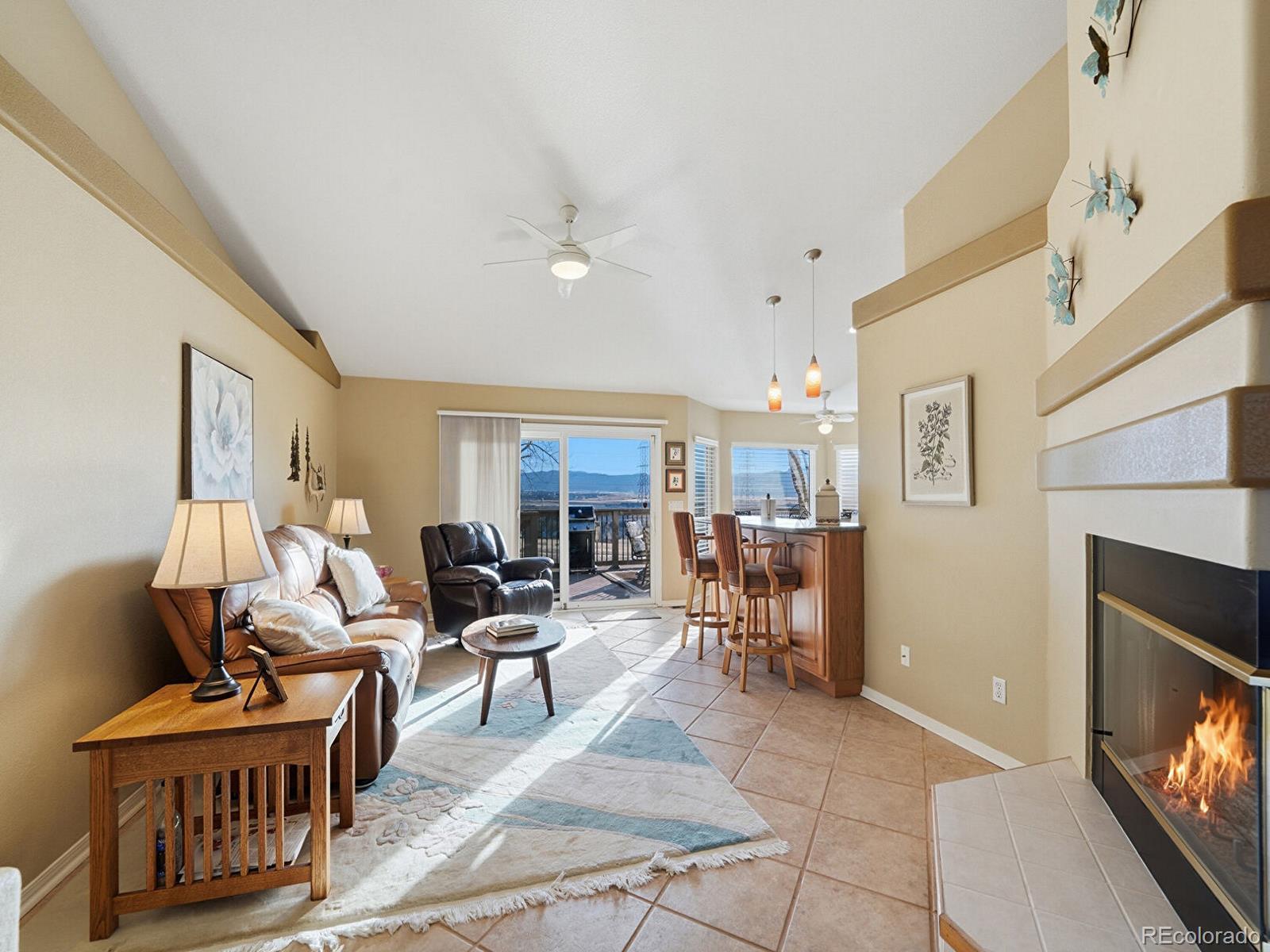 3308 Oak Leaf Place Highlands Ranch, CO 80129 - Photo 9 of 50 a living room with furniture and a flat screen tv