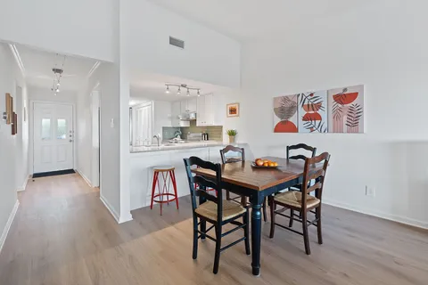 a kitchen with cabinets appliances and a sink