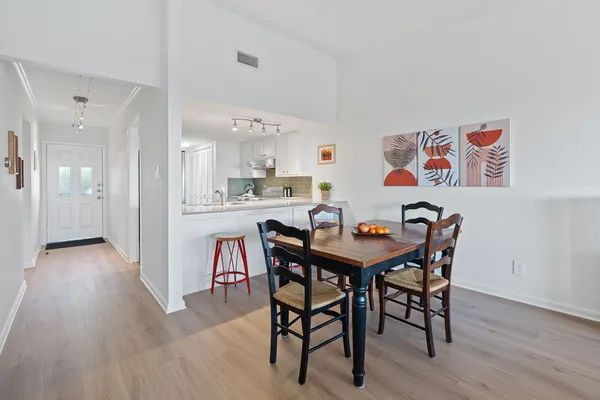 a kitchen with cabinets appliances and a sink