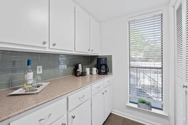 a kitchen with a stove cabinets and a sink