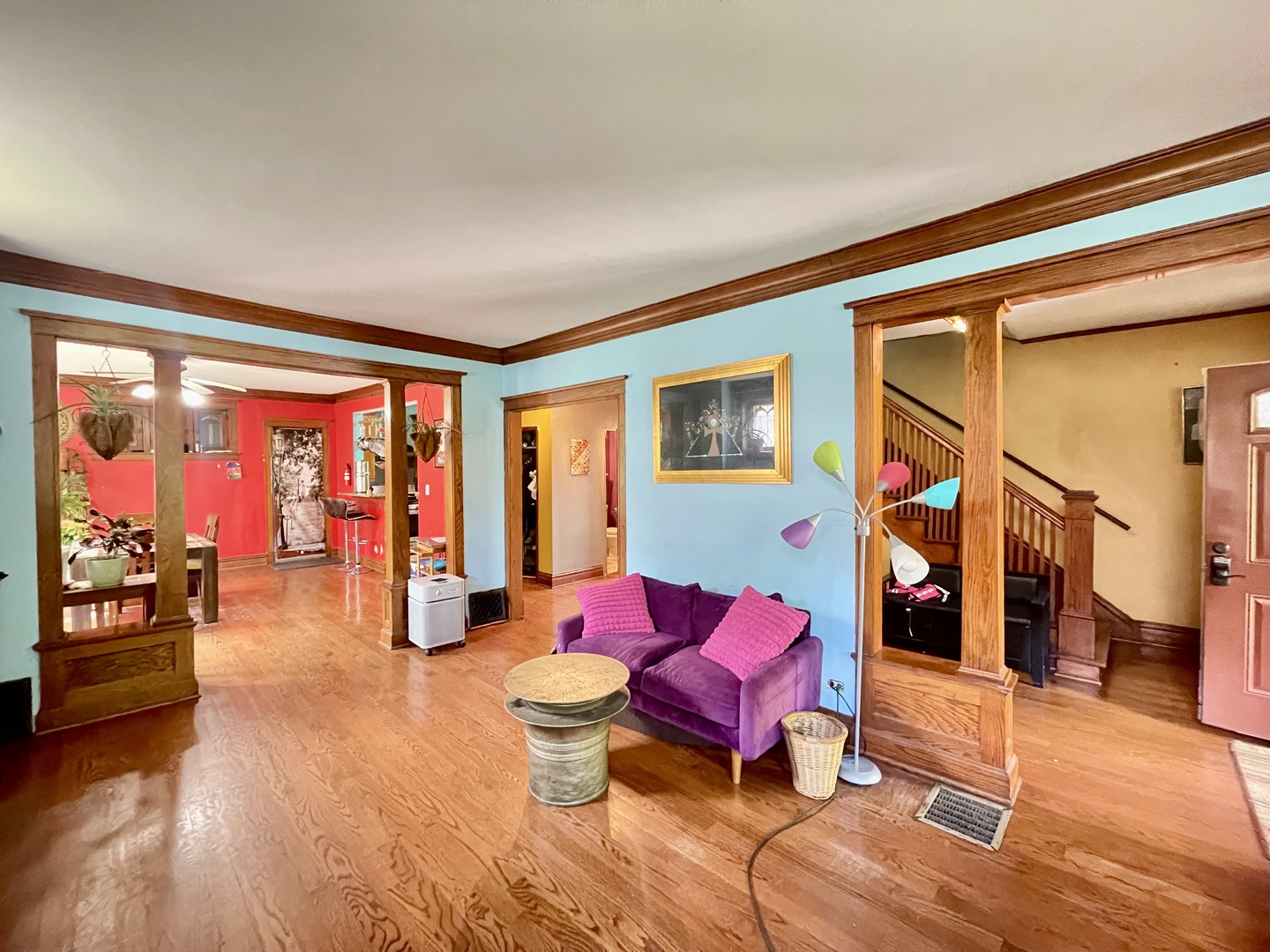 7916 South Constance Avenue Chicago, IL 60617 - Photo 4 of 28 a living room with furniture a rug and a floor to ceiling window