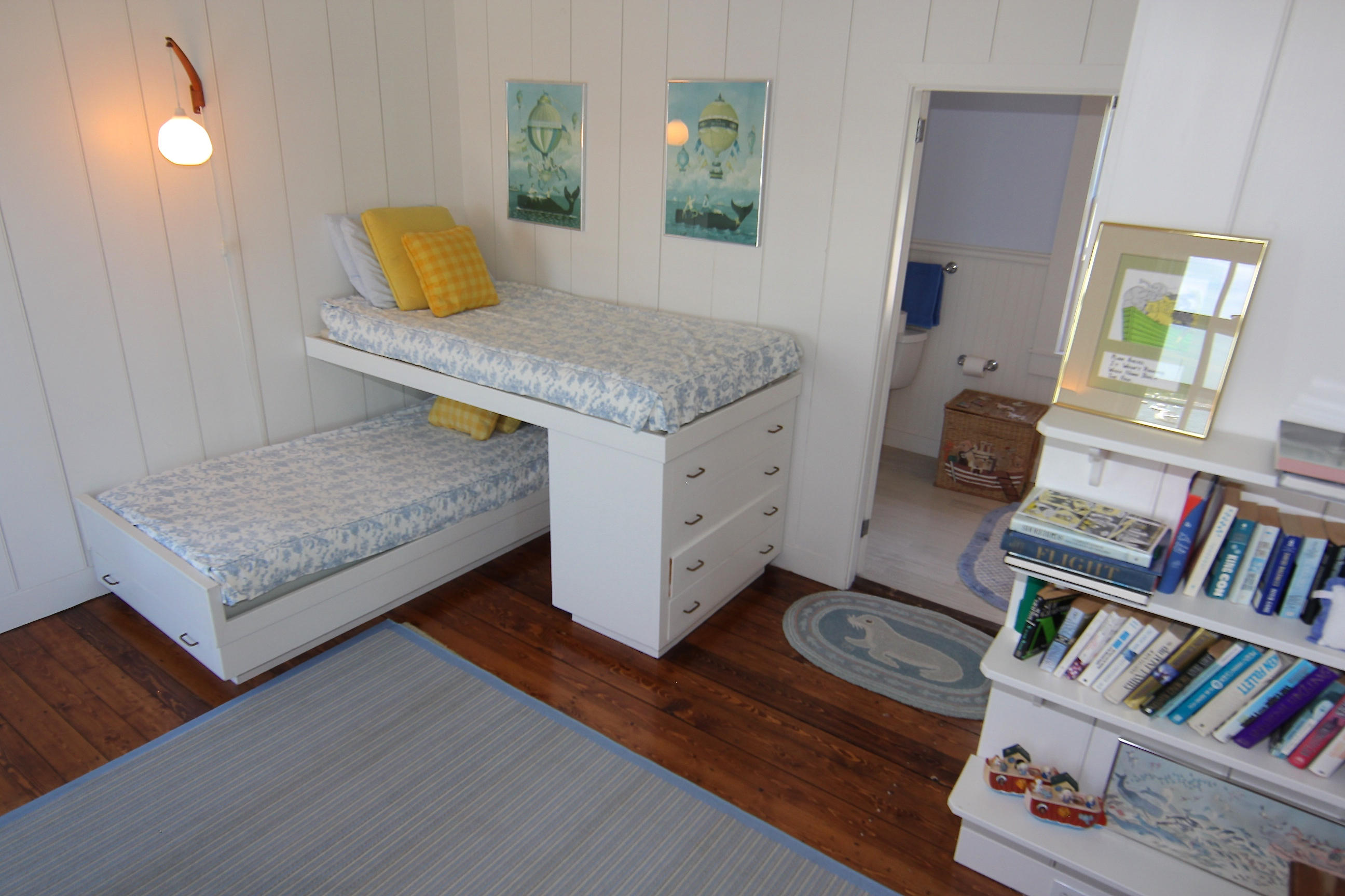 8 Beach Street Edgartown, MA 02539 - Photo 20 of 42 a living room with furniture and a book shelf