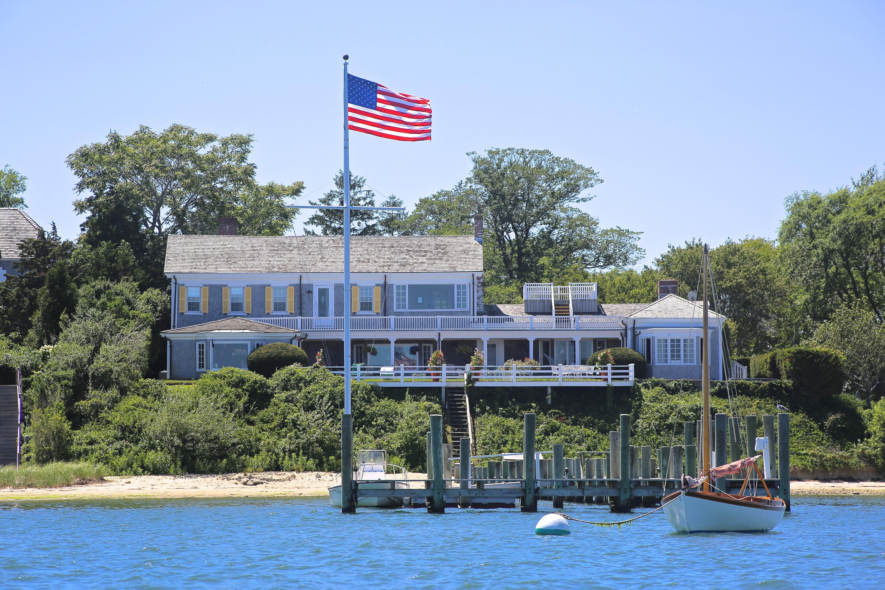 8 Beach Street Edgartown, MA 02539 - Photo 2 of 42 a view of a chairs and table on the wooden floor