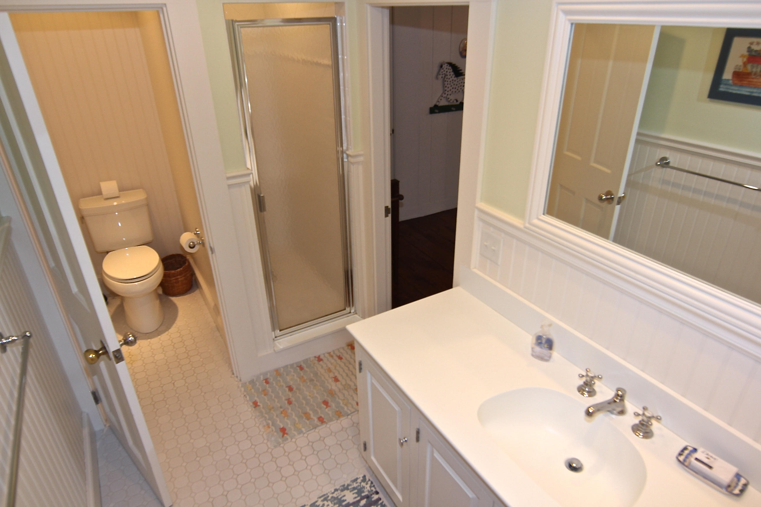 8 Beach Street Edgartown, MA 02539 - Photo 24 of 42 a bathroom with a sink a toilet and shower