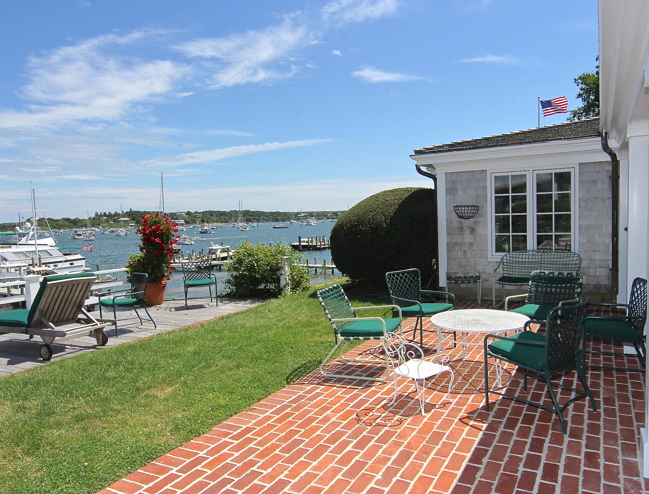 8 Beach Street Edgartown, MA 02539 - Photo 29 of 42 a view of a house with backyard sitting area and furniture