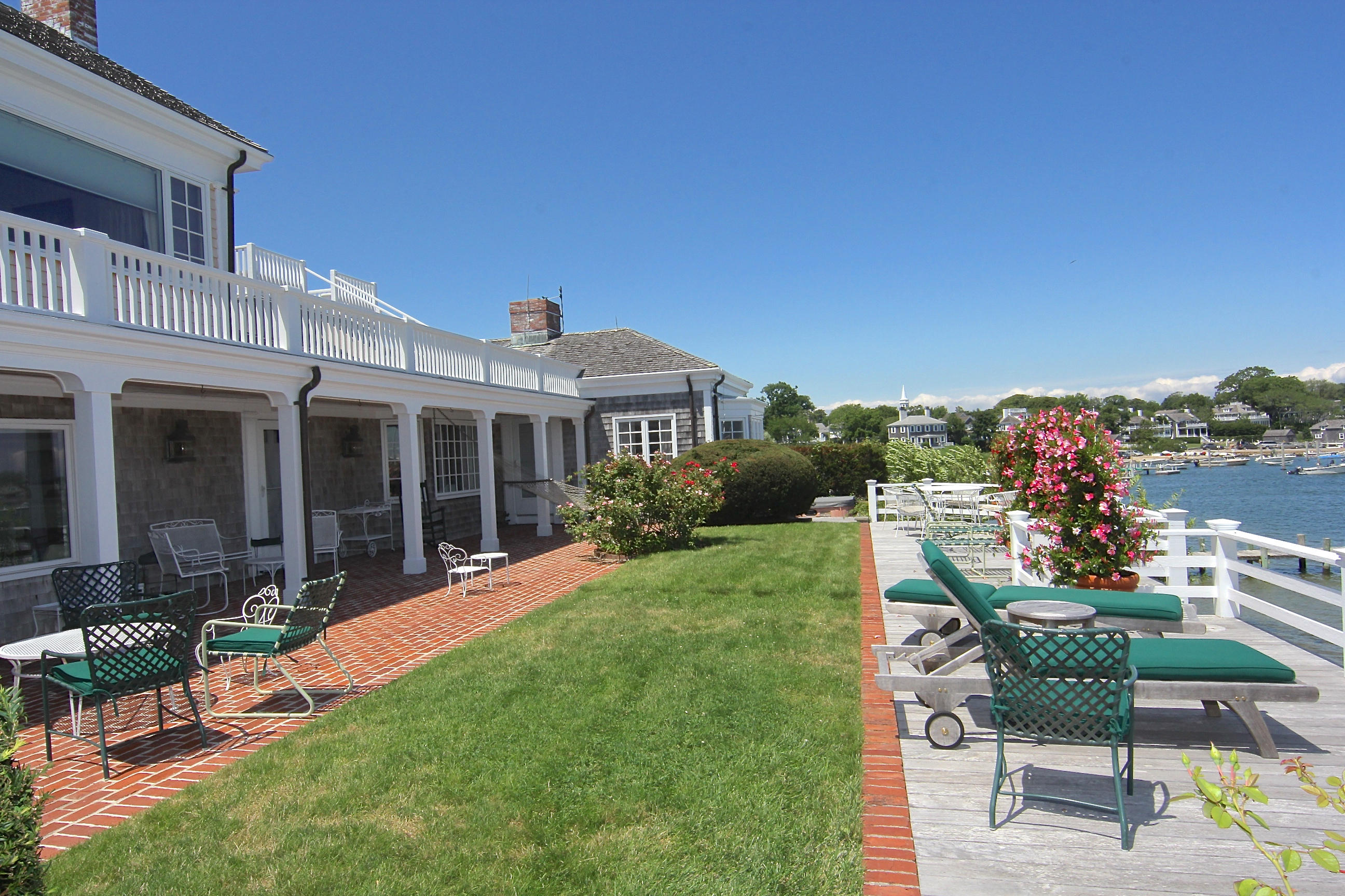 8 Beach Street Edgartown, MA 02539 - Photo 30 of 42 a view of a house with backyard sitting area and garden