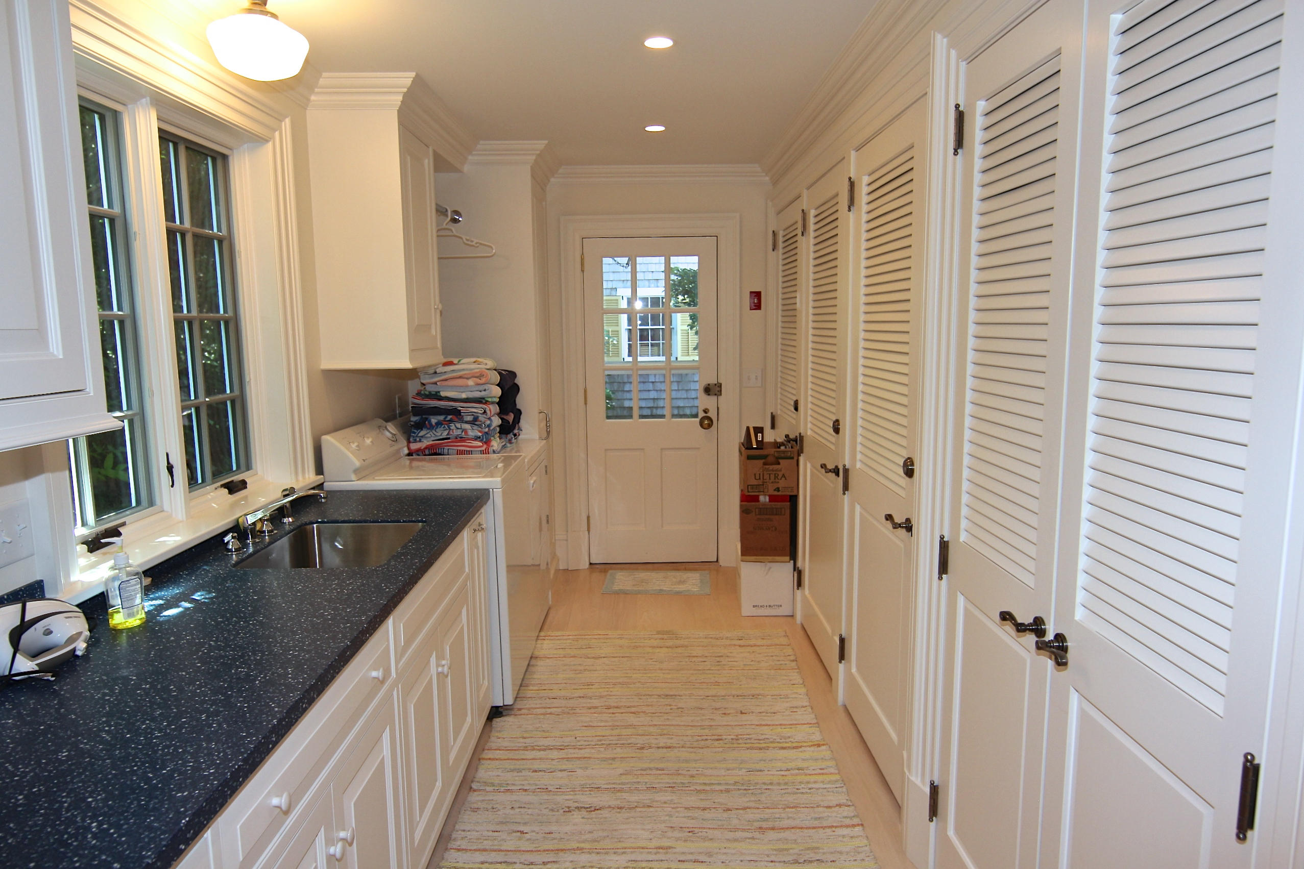 8 Beach Street Edgartown, MA 02539 - Photo 8 of 42 a bathroom with a granite countertop double vanity sink a mirror and a bathtub