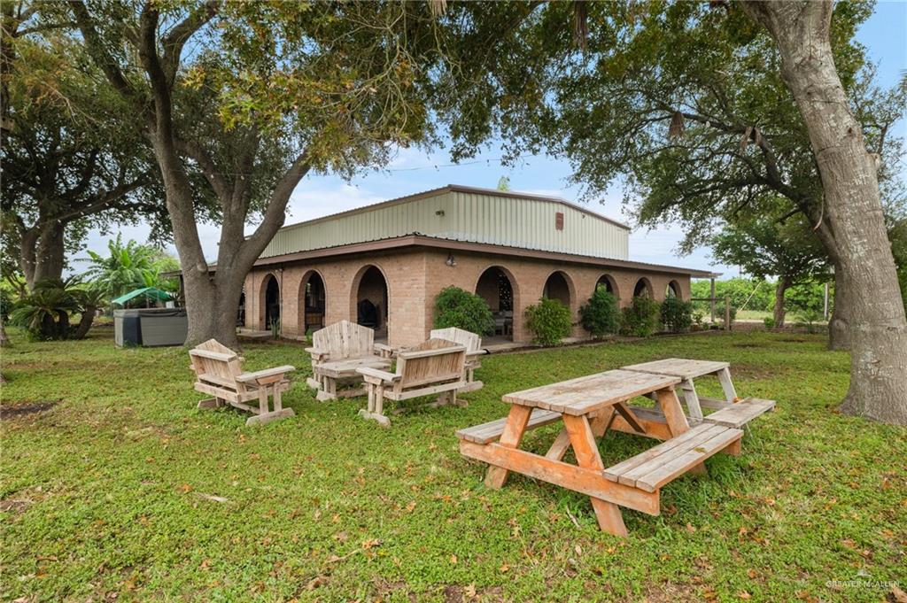 492 West Trenton Road Donna, TX 78537 - Photo 6 of 20 a front view of a house with garden and sitting area