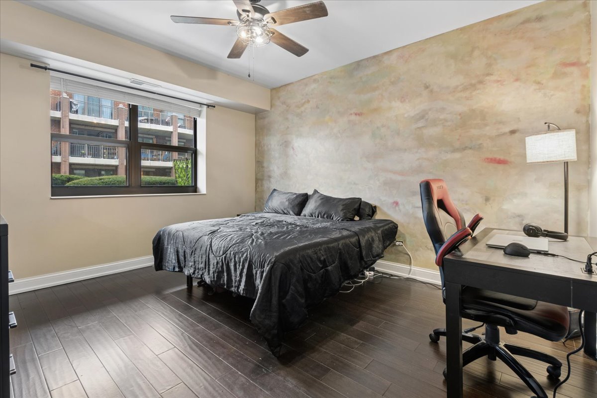1155 South State Street, Unit 400 Chicago, IL 60605 - Photo 11 of 27 a bedroom with a bed and a desk