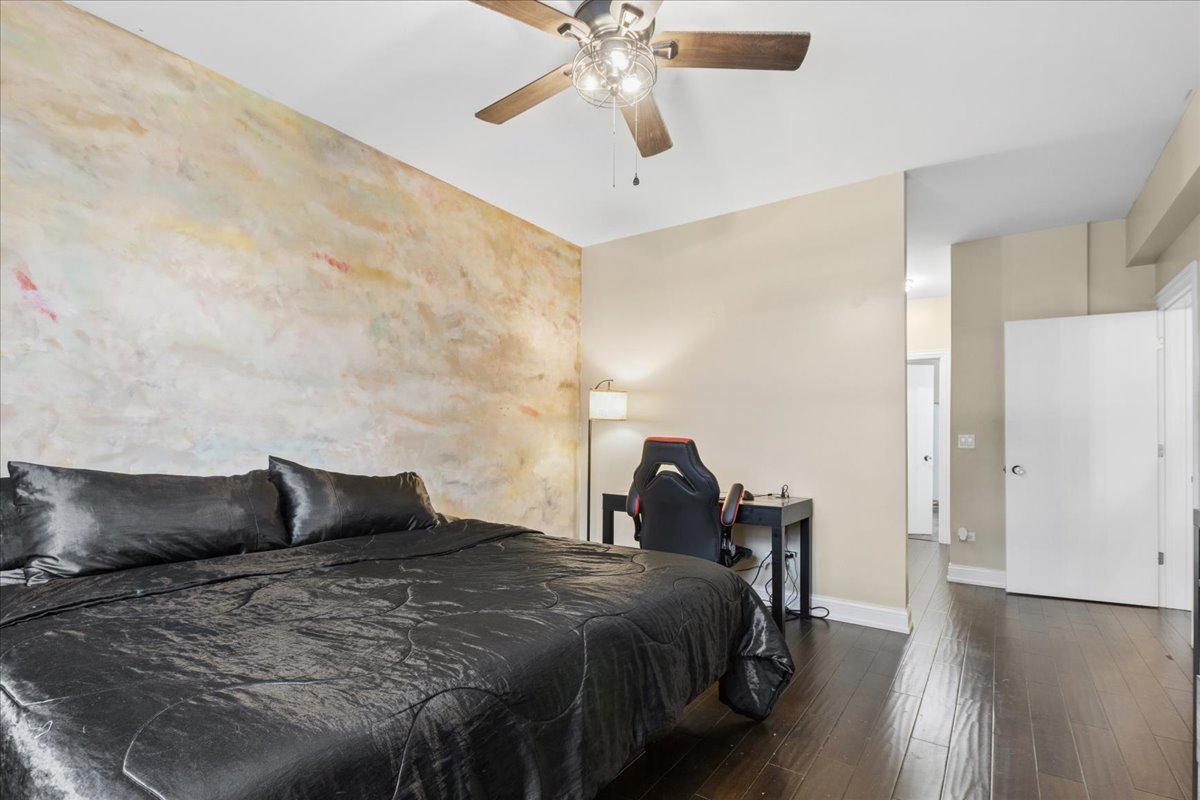 1155 South State Street, Unit 400 Chicago, IL 60605 - Photo 12 of 27 a bedroom with a bed and cabinets